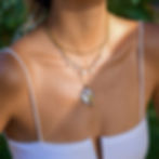 Model wearing 316L stainless steel fish pendant necklace with ocean-inspired pendant